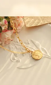 Detailed view of 18K gold plated double layer necklace with vintage coin pendant