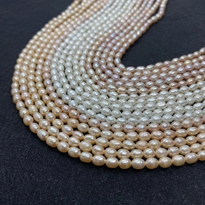 Macro detail of natural freshwater rice pearls in white, pink, and lilac colors