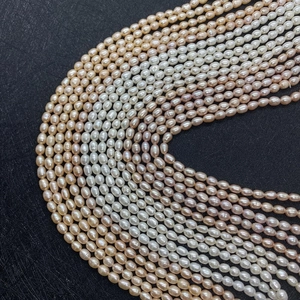 Close-up of natural rice-shaped freshwater pearls in white pink and purple hues