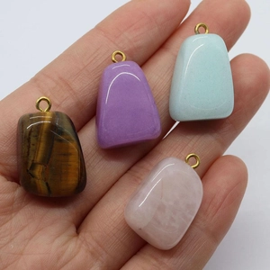 Handheld irregular natural tiger eye and rose quartz stones with gold pendant bails