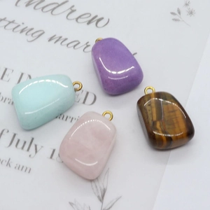 Irregular natural tiger eye and rose quartz gemstone pendants with gold metal rings