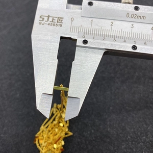 Detailed measurement of gold rectangular pendant using a digital caliper tool