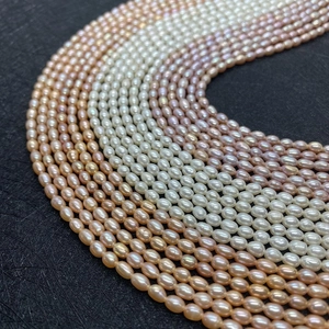 Grade 3A natural rice-shaped freshwater pearls in white, pink, and peach for DIY jewelry