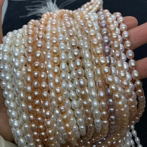Detailed close-up of multicolor natural freshwater pearls in white, pink, and purple shades