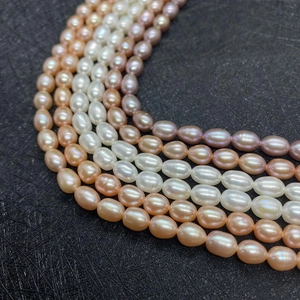 Macro detail of high-luster rice-shaped natural freshwater pearls in mixed pastel colors
