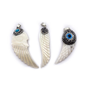 Three-piece set of wing-shaped freshwater shell pendants with diamond-set metal bails