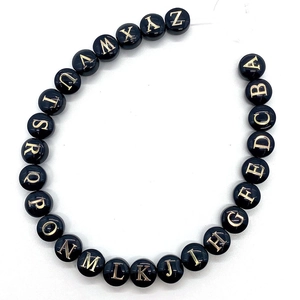 Black round beads set with 26 golden engraved letters A-Z for DIY necklace crafts