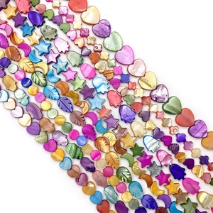 Colorful mother of pearl shell beads in star, heart, and hamsa shapes for DIY jewelry