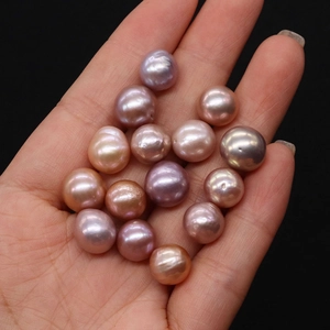 Detailed macro shot of natural Edison freshwater pearls in assorted purple and pink shades