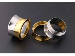 Detail of two-tone stainless steel ear tunnels with threaded screw-fit design