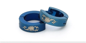Detail view of blue stainless steel hoop earrings featuring a silver laser-etched scorpion