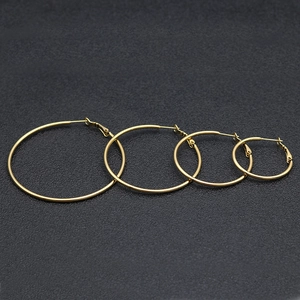 Classic gold titanium steel hoop earrings set in four sizes for minimalist fashion style