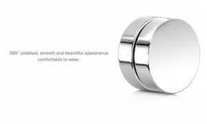 Detail view of mirror polished silver titanium steel magnetic earrings with smooth surface