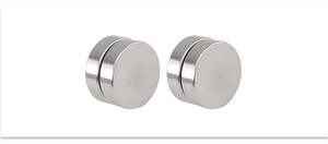 Close-up of silver magnetic stainless steel round stud earrings with polished mirror finish