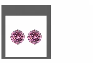 Detailed macro view of pink round-cut AAA cubic zirconia studs with four-claw silver settings