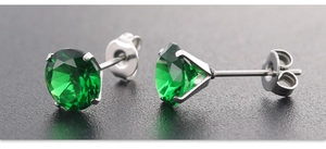 Detailed view of 7mm emerald green zircon stud earrings with four-prong silver setting