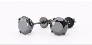 Macro close-up of black round-cut zircon earrings with four-prong titanium steel setting
