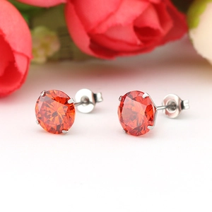 7mm round orange-red zircon stud earrings in titanium steel with a classic 4-prong setting
