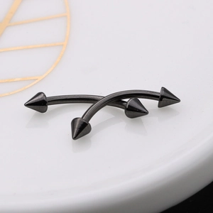 Pair of black titanium steel curved barbells with spike ends for eyebrow and lip piercing
