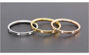 Three minimalist titanium steel rings in silver gold and rose gold with matte finish