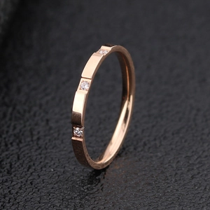 Minimalist rose gold titanium steel ring with sparkling cubic zirconia insets for women