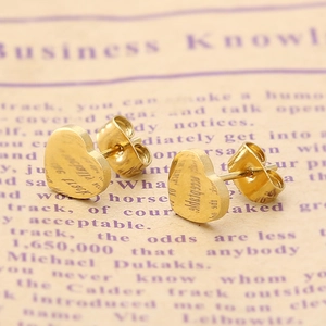 Boucles d'oreilles cœur minimalistes en acier inoxydable doré sur papier vintage