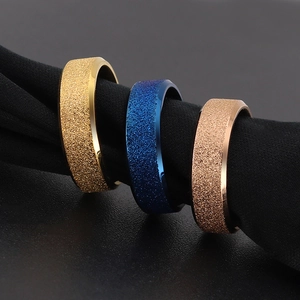 Frosted stainless steel rings in gold, blue and rose gold with a sandblasted finish