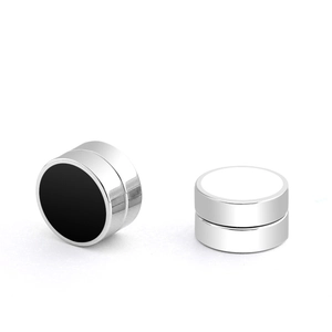 Detail of silver magnetic clip-on earrings with black and white enamel circle inlay
