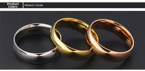 Polished titanium steel rings in silver, gold, and rose gold on black background