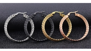 Detail view of large hoop earrings in four metallic colors with spiral textured finish