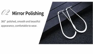 Macro detail of silver teardrop hoop earrings with high-polish mirror finish and pin closure