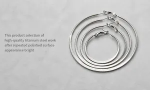 Macro detail of high quality polished titanium steel hoop earrings with fine surface texture