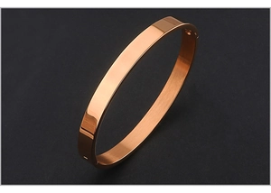 Detail view of rose gold stainless steel oval bangle featuring a hinge closure design