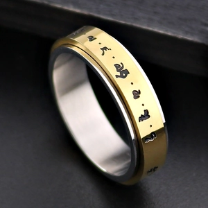 Anillo giratorio bicolor de acero inoxidable con caracteres negros vintage grabados