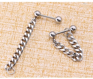 Macro detail of silver titanium steel punk style barbell with cuban chain links
