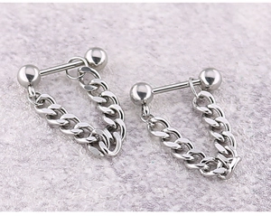 Detail of silver titanium punk earring with barbell stud and hanging Cuban link chain