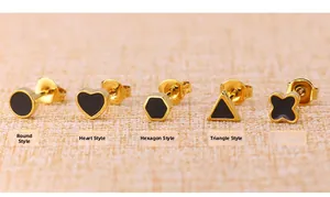 Minimalist gold titanium stud earrings set with black enamel in geometric shapes