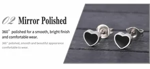 Detailed close-up of heart-shaped titanium steel studs with black enamel and mirror polish