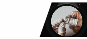 Macro view of a heart-shaped steel stud earring during precise quality inspection process