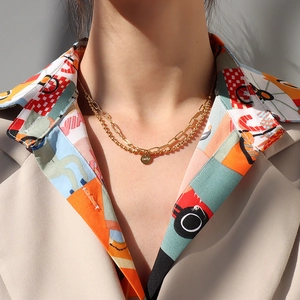 Collier double rangée en or avec disque Lucky, chaîne trombone et chaîne à billes