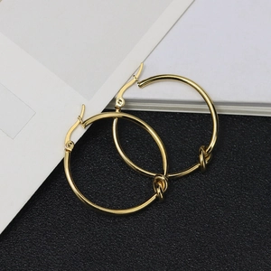Minimalist gold-plated stainless steel hoop earrings with a stylish knot design