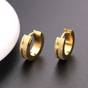 Golden stainless steel huggie hoop earrings with matte finish and polished grooves