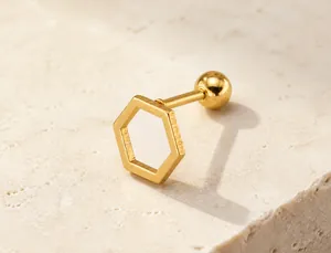 Detailed view of golden hexagonal stainless steel stud earring with screw back closure
