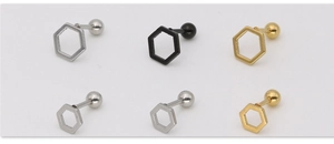 Macro shot of hexagonal honeycomb stud earrings in silver, black and gold finishes