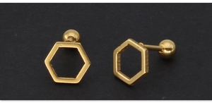 Macro view of gold geometric hexagonal stud earrings with ball screw back closures