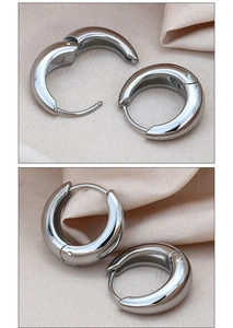 Detailed views of polished silver chunky hoop earrings with snap closure on silk