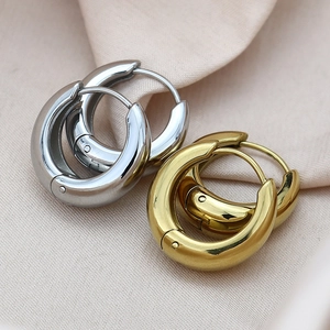Minimalist chunky round hoop earrings in polished gold and silver finishes