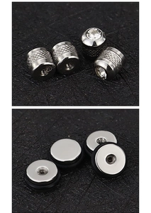 Polished stainless steel screw-on piercing caps with rhinestone and knurled details