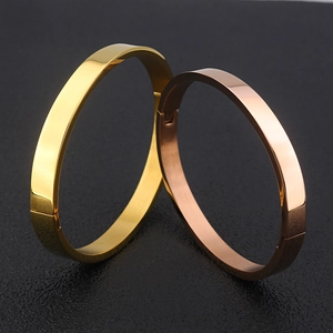 Minimalist stainless steel oval bangles in gold and rose gold finish with mirror polish