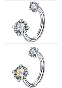 Macro detail of horseshoe barbell body piercing with zircon inlays and clear vs AB crystals